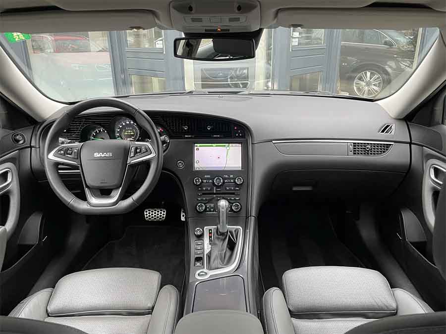 The meticulously crafted interior of the 2010 Saab 9-5 NG Aero XWD features ventilated leather seats, a Harman Kardon sound system, and Saab’s signature driver-focused cockpit.