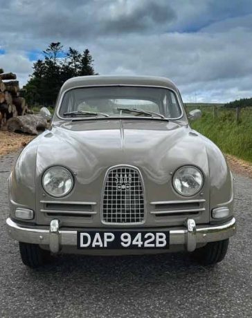 The 1964 Saab 96 in its original Savannabrun finish, a beautifully preserved example of Swedish engineering, now seeking a new owner to continue its storied legacy.