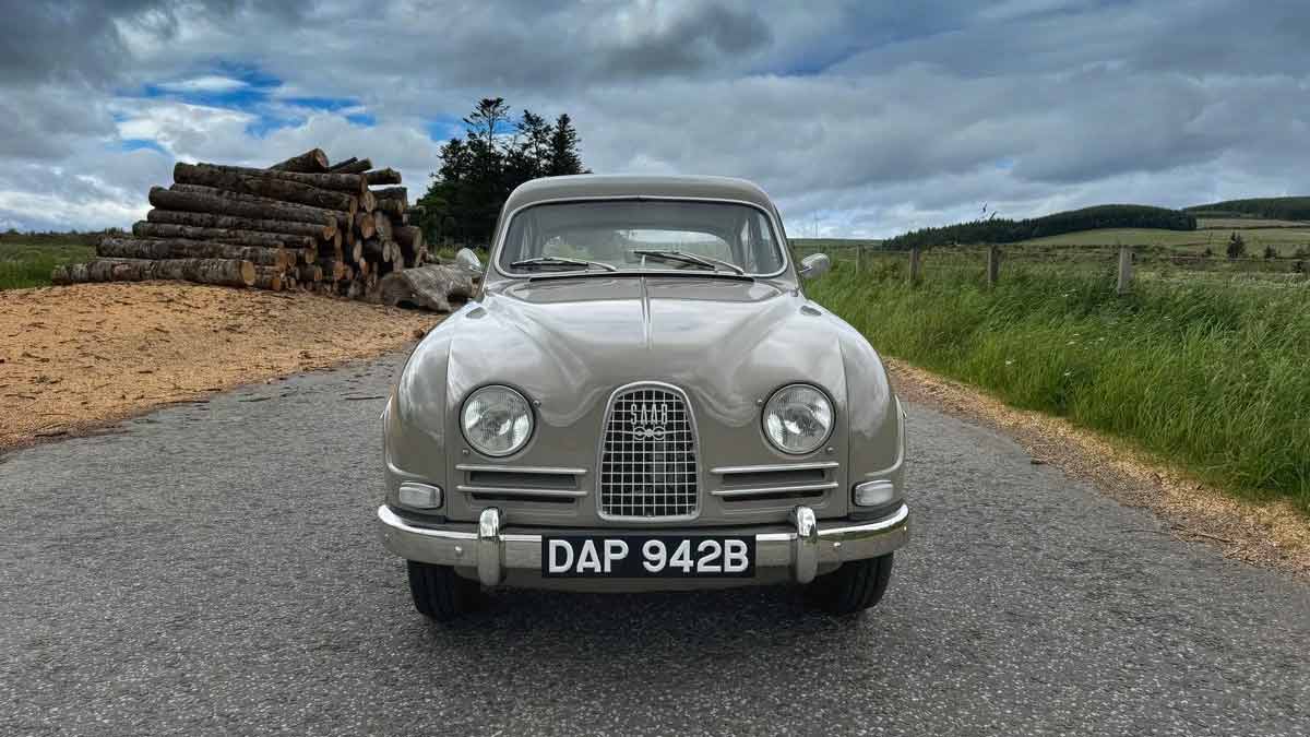 The 1964 Saab 96 in its original Savannabrun finish, a beautifully preserved example of Swedish engineering, now seeking a new owner to continue its storied legacy.