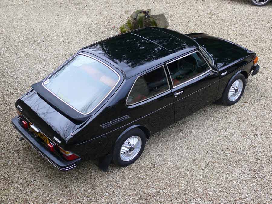 Iconic beauty redefined: The Saab 99 Turbo (DWB 710V) stands out in Jet Black, showcasing its timeless design and powerful presence on the road, a true testament to automotive excellence