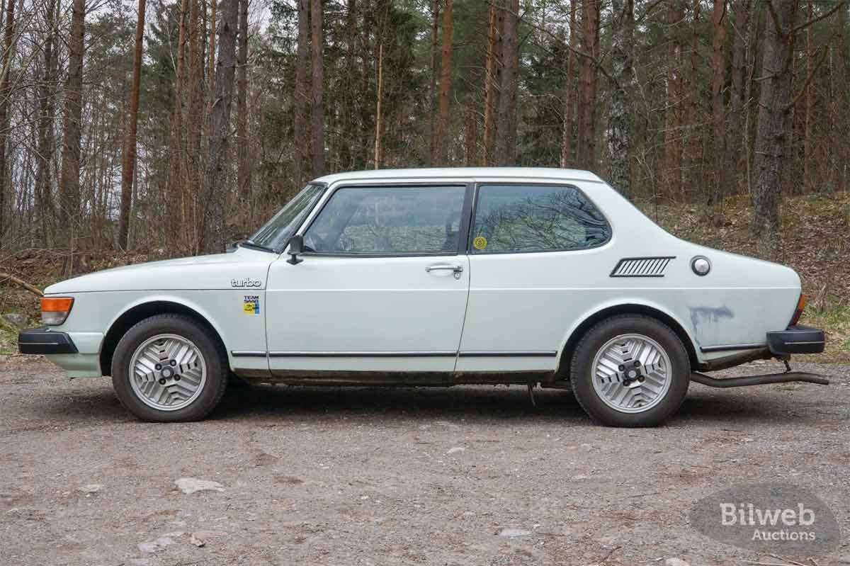 1980 Saab 99 Turbo showcased in a serene forest setting, highlighting its classic design and distinctive turbo features.