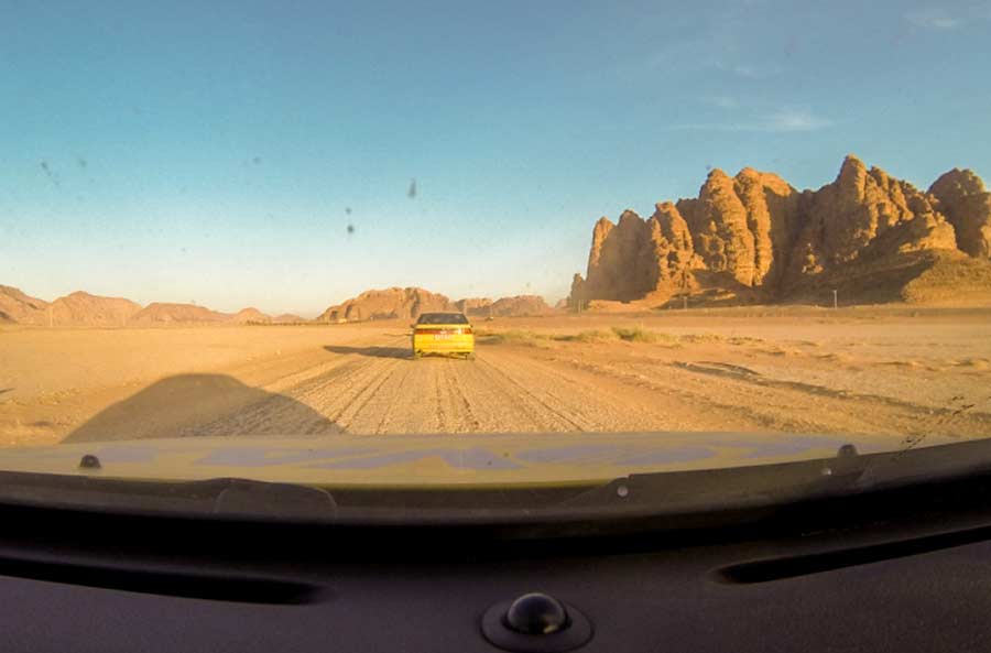 Saab 9000 cars in the middle of the desert