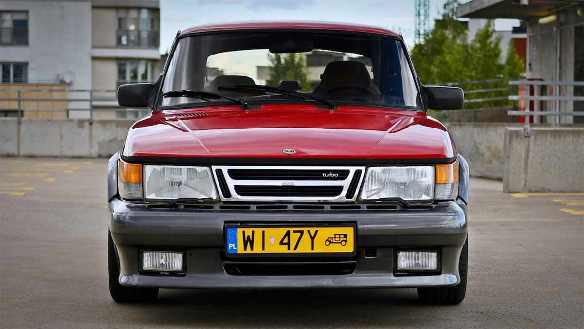 the rare Saab 900 Red Arrow, a limited edition Dutch market model, showcasing its distinctive grey AirFlow body kit and iconic whale tail spoiler.