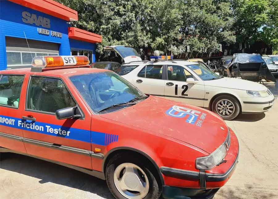 The rare 1996 Saab 9000 SFT and a 2005 Saab 9-5 SFT, both friction tester vehicles, displayed at the Saab parts shop. These specialized cars, used for airport runway testing, highlight Saab's legacy in aviation safety. The recent discovery and upcoming auction of the 9000 SFT have drawn global interest from collectors.