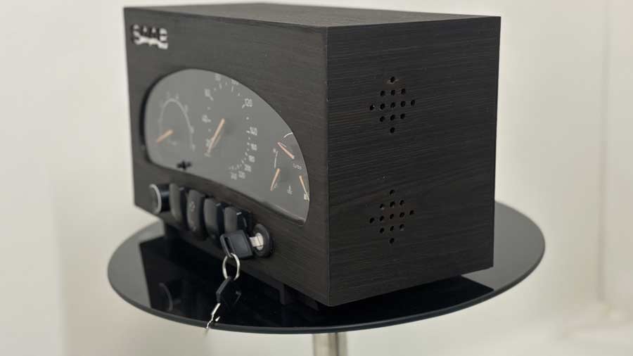 A side profile of the SAAB MIU Clock, showcasing its handcrafted wooden veneer housing, integrated speaker vents, and precision craftsmanship that brings this unique Saab-inspired timepiece to life.