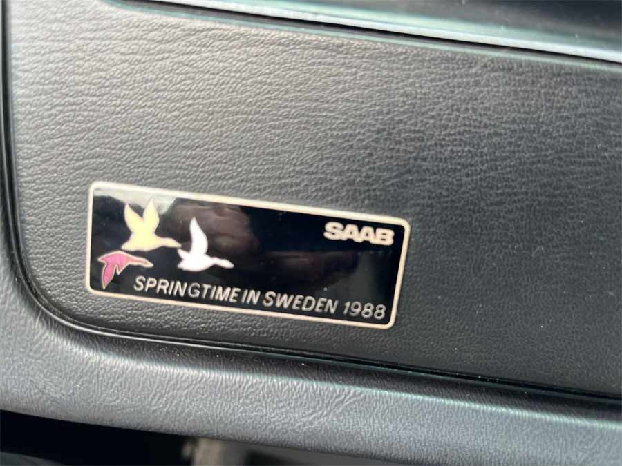 Plaque indicating the exclusive "Springtime in Sweden 1988" edition of the Saab 900 Turbo Convertible, highlighting its limited production and unique status among classic car enthusiasts.