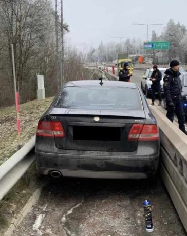 Saab Stuck Between Highway Guardrails