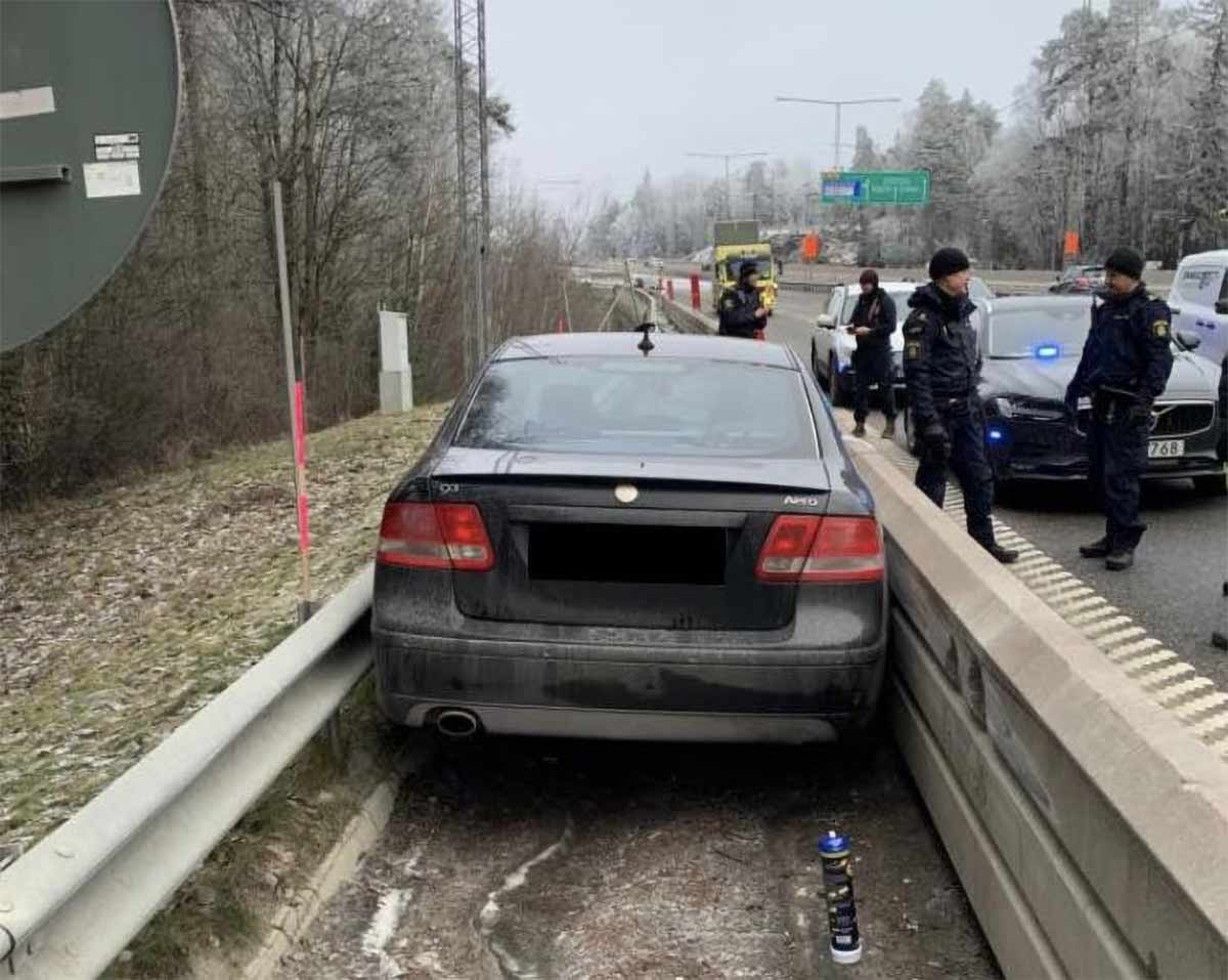 Saab Stuck Between Highway Guardrails