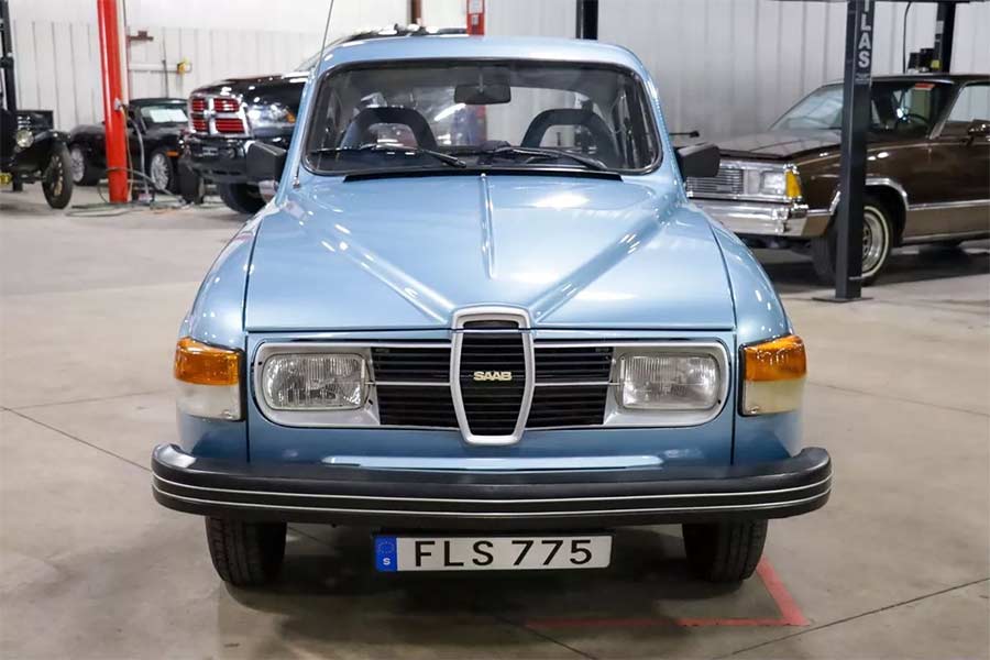 Front view of the pristine 1980 Saab 96 GL Jubileum, showcasing its unique rectangular halogen headlights with integrated wipers—iconic Saab detailing at its finest.