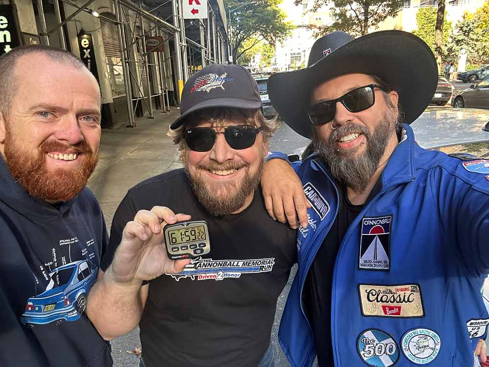 Celebrating victory: Wes Vigh, Nik Krueger, and Christopher Michaels proudly display their record-breaking time of 61:59 after an unforgettable Cannonball Run.