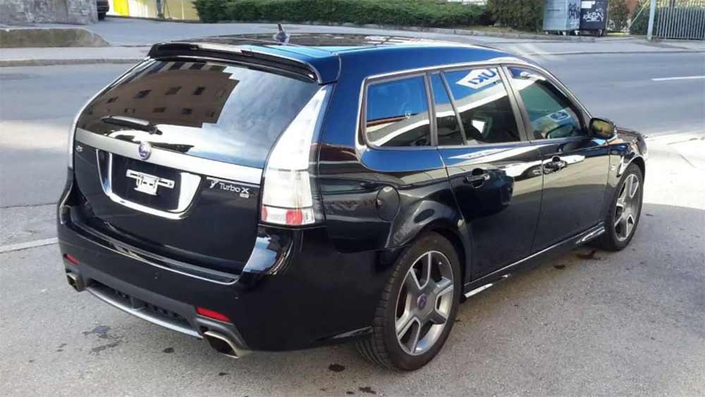 A sleek black Saab 9-3 Turbo X station wagon, identified by its exclusive Turbo X badging, stands as the most powerful of its kind currently advertised in Europe, showcasing its sporty design and performance-oriented stance.