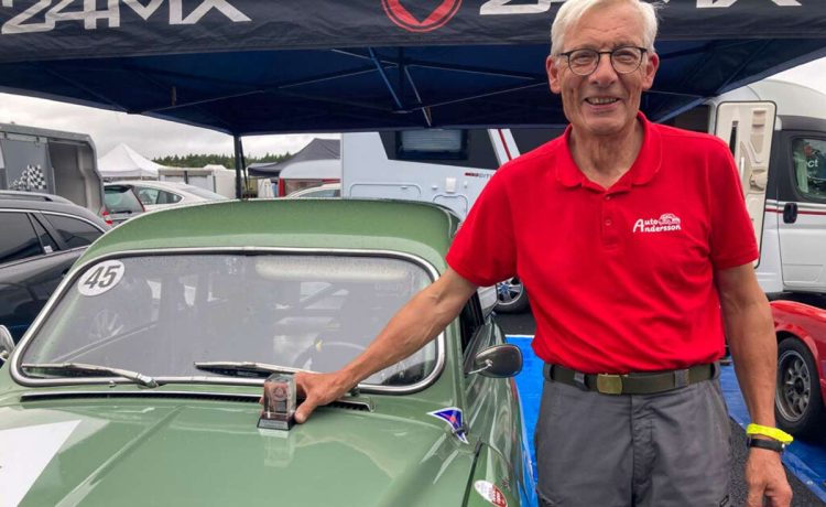 Joyful driver and writer, celebrating a second-place trophy after a race on the historic circuit at Anderstorp Raceway