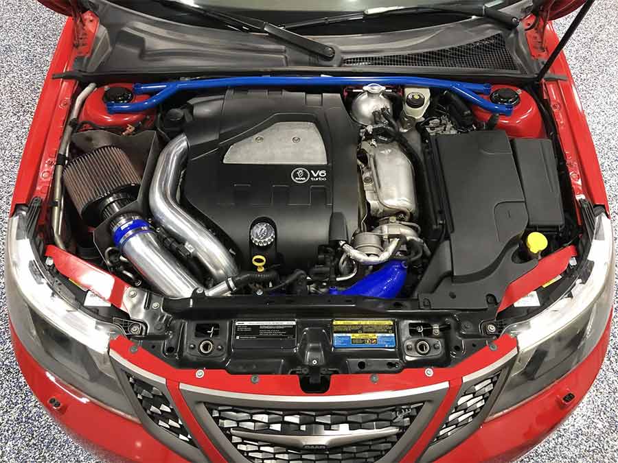 Under the hood of this 2008 Saab 9-3 Aero SportCombi lies a turbocharged 2.8L V6, enhanced with a Taliaferro cold air intake, DO88 intercooler hoses, and a Vtune Stage-0 ECU tune—pushing this Swedish sleeper to an estimated 345 HP and 430 lb-ft of torque.