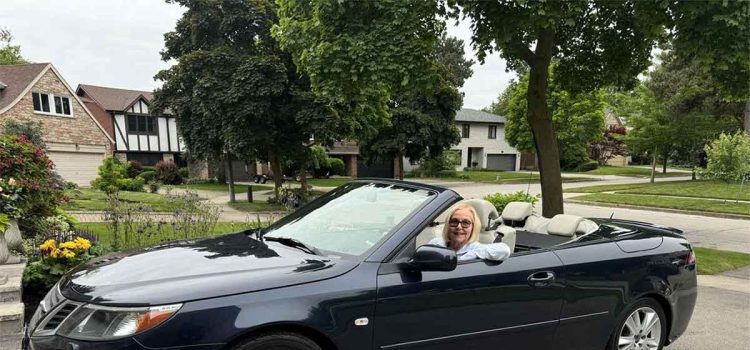 Vicki Griffiths enjoys the freedom of driving through the Caledon Hills in her navy blue 2008 Saab 9-3 Convertible with the top down.