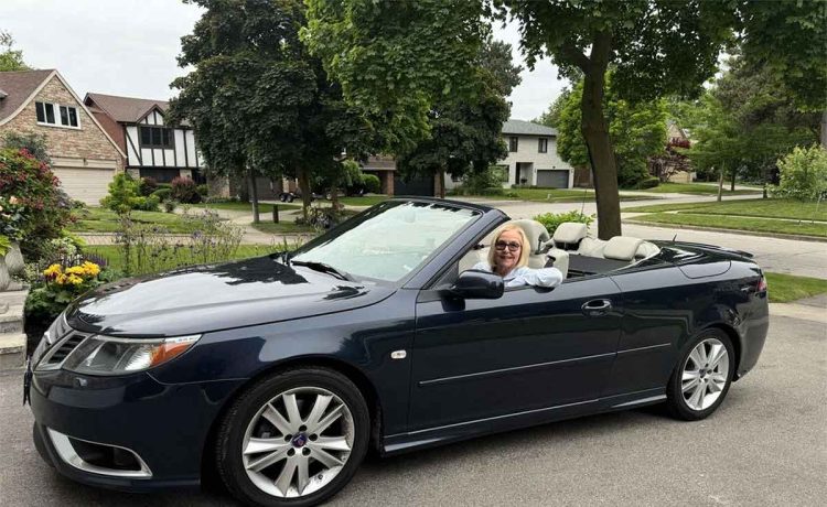 Vicki Griffiths enjoys the freedom of driving through the Caledon Hills in her navy blue 2008 Saab 9-3 Convertible with the top down.