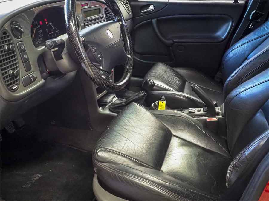 Inside the 2001 Saab 9-3 Viggen: Driver-Focused Cockpit with Sporty Black Leather Seats Emphasizing Swedish Luxury and Performance